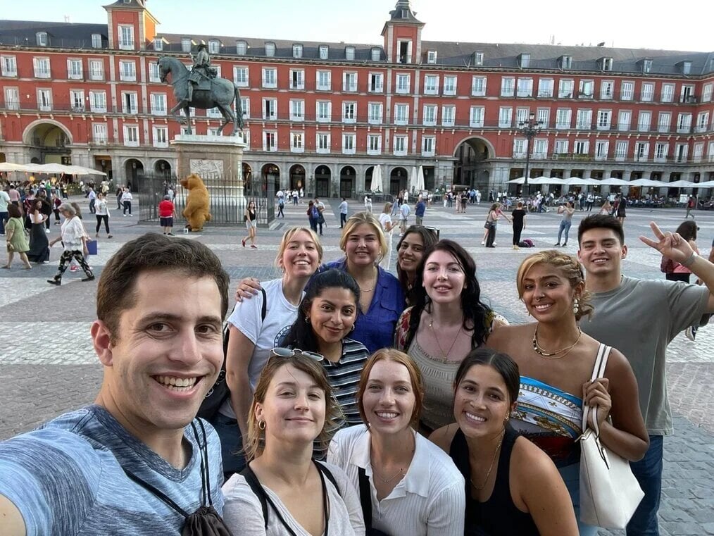 CIEE Spain A group of people smile for the camera in Plaza Mayor in Madrid.